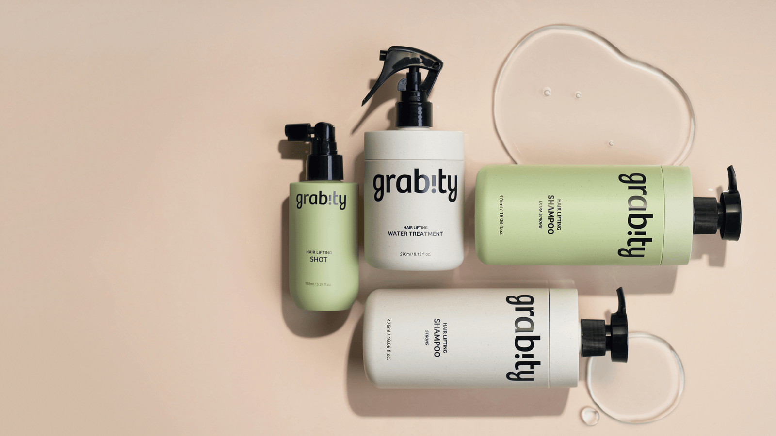 Grabity hårvårdsserie med schampo, Hair Lifting Shot och Water Treatment arrangerade på beige bakgrund tillsammans med produkttexturer för volymgivande och stärkande hårvård.