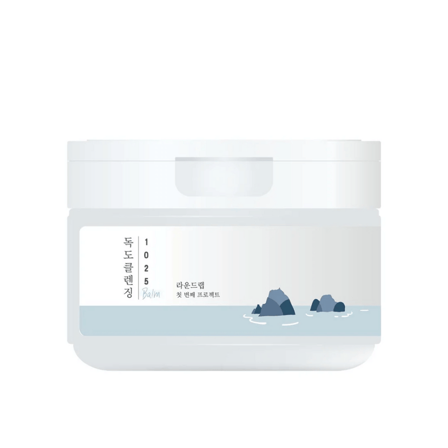 Uzavretá biela nádoba 1025 Dokdo Cleansing Balm s minimalistickou námornou témou na etikete, na bielom pozadí.