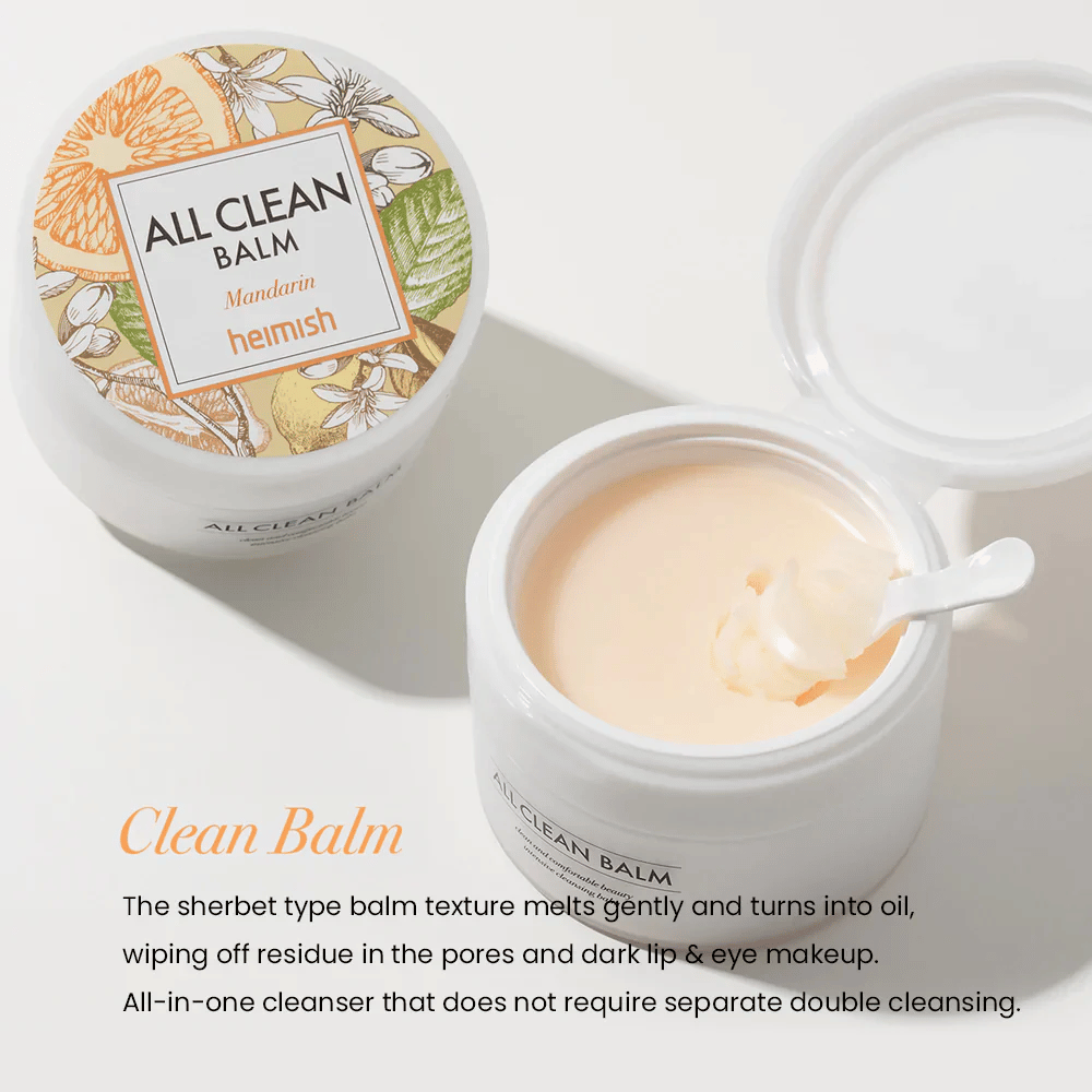 Otvorený pohár Heimish All Clean Balm Mandarin s lyžičkou miešajúcou krémový čistiaci balzam, s farebnou etiketou a textom 'Clean Balm' v popredí.