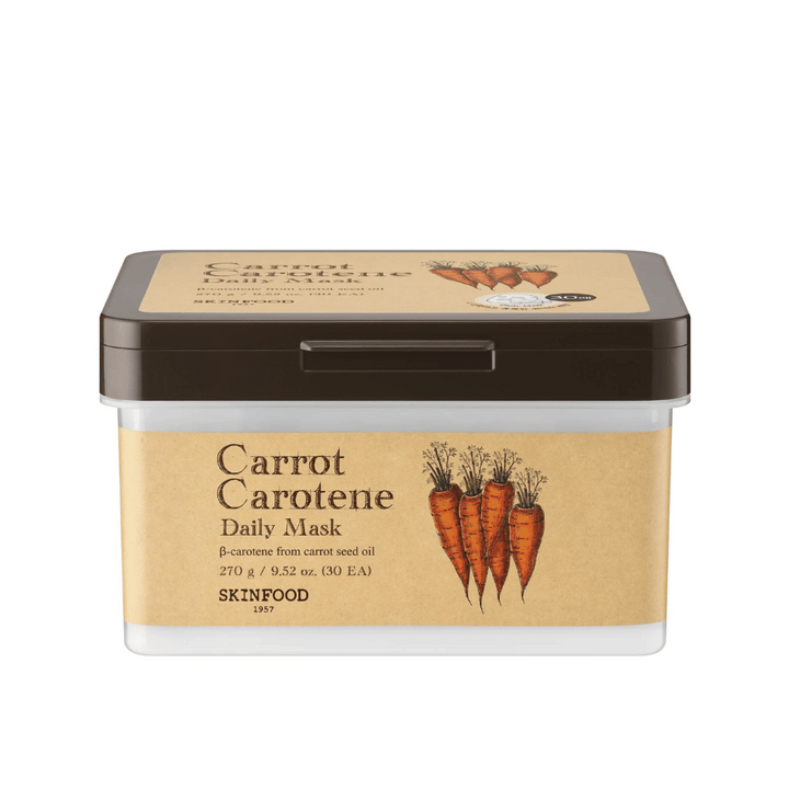 Balenie "Carrot Carotene Daily Mask" od SKINFOOD, obsahujúce 30 pleťových masiek. Produkt je obohatený o β-karotén z oleja z mrkvových semien a je navrhnutý na každodenné použitie. Balenie je robustné s vintage inšpirovanou etiketou, ktorá zvýrazňuje mrkvu ako hlavnú zložku.