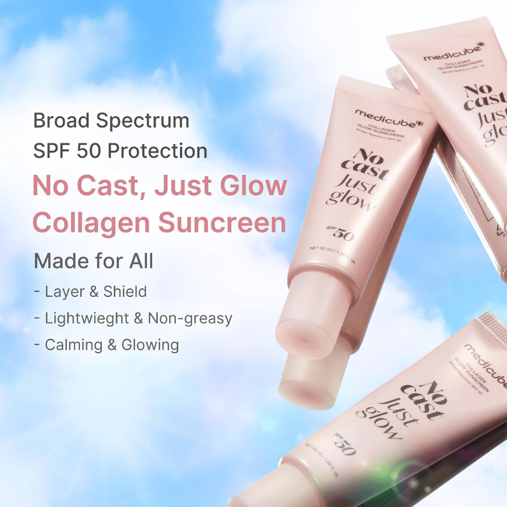 Medicube Collagen Glow Sunscreen SPF 50, ľahký opaľovací krém s glow efektom bez bieleho filmu. Ružové tuby opaľovacieho krému na pozadí modrej oblohy.