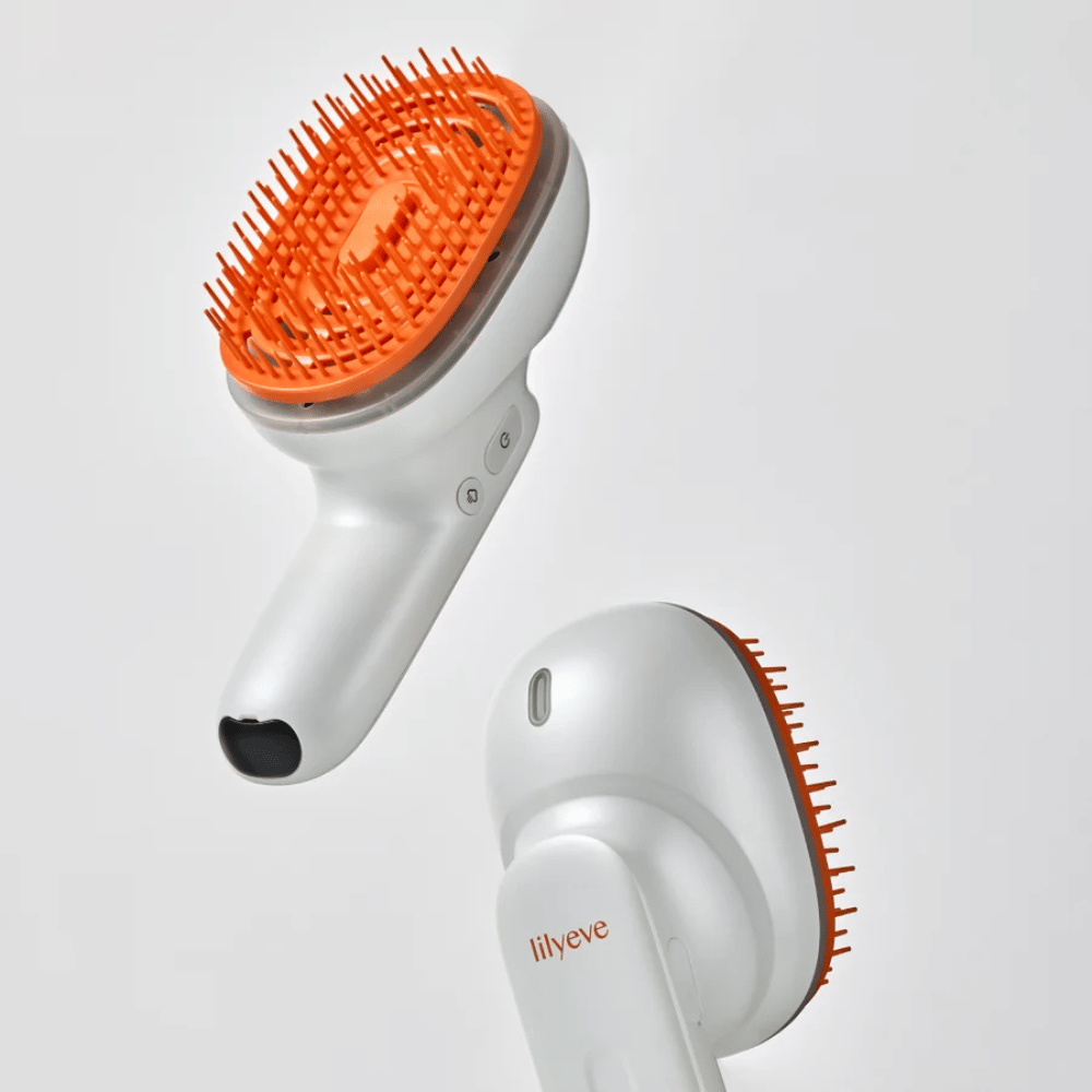 LILYEVE GrowTurn Brush Steam Booster – predná a zadná strana s ergonomickou rukoväťou a oranžovými štetinami