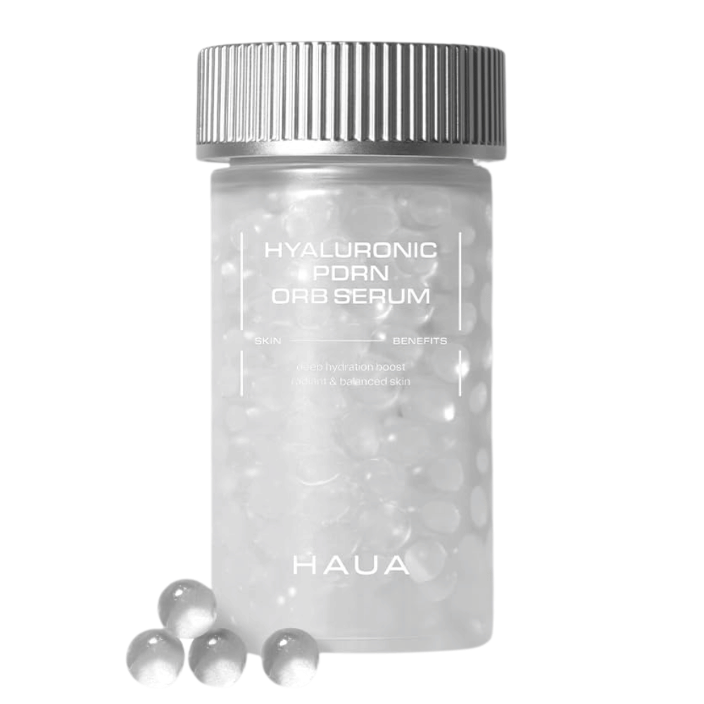 Produktový obrázok HAUA Hyaluronic PDRN Orb Serum na bielom pozadí. Priehľadná nádobka je naplnená sérovými guľôčkami a zdôrazňuje jedinečné zapuzdrené zloženie produktu.