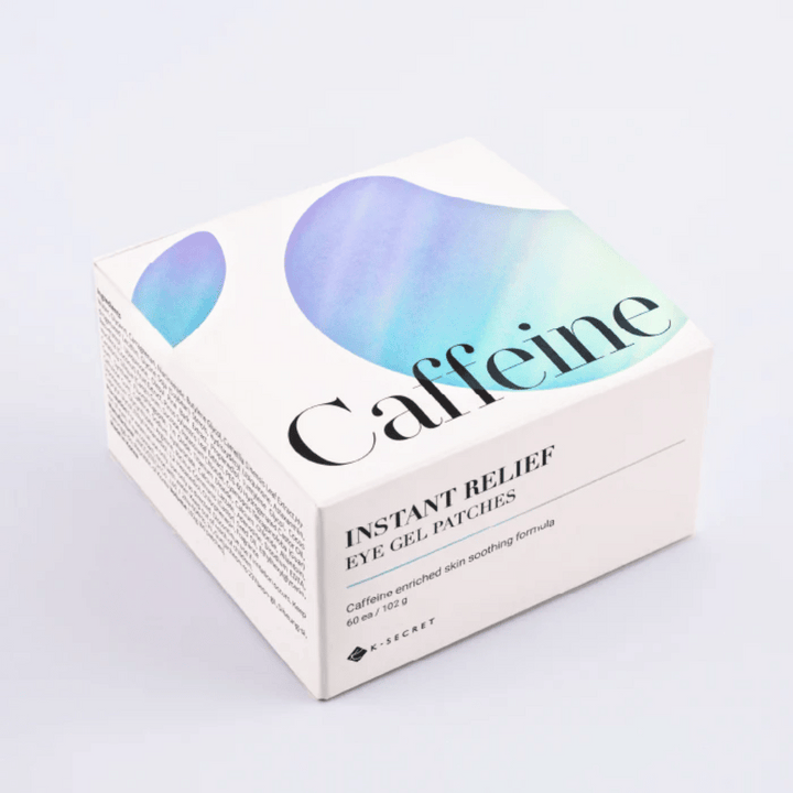 Balenie K-Secret Instant Relief Eye Gel Patches s kofeínom v bielom dizajne s modrými a zelenými tónmi.