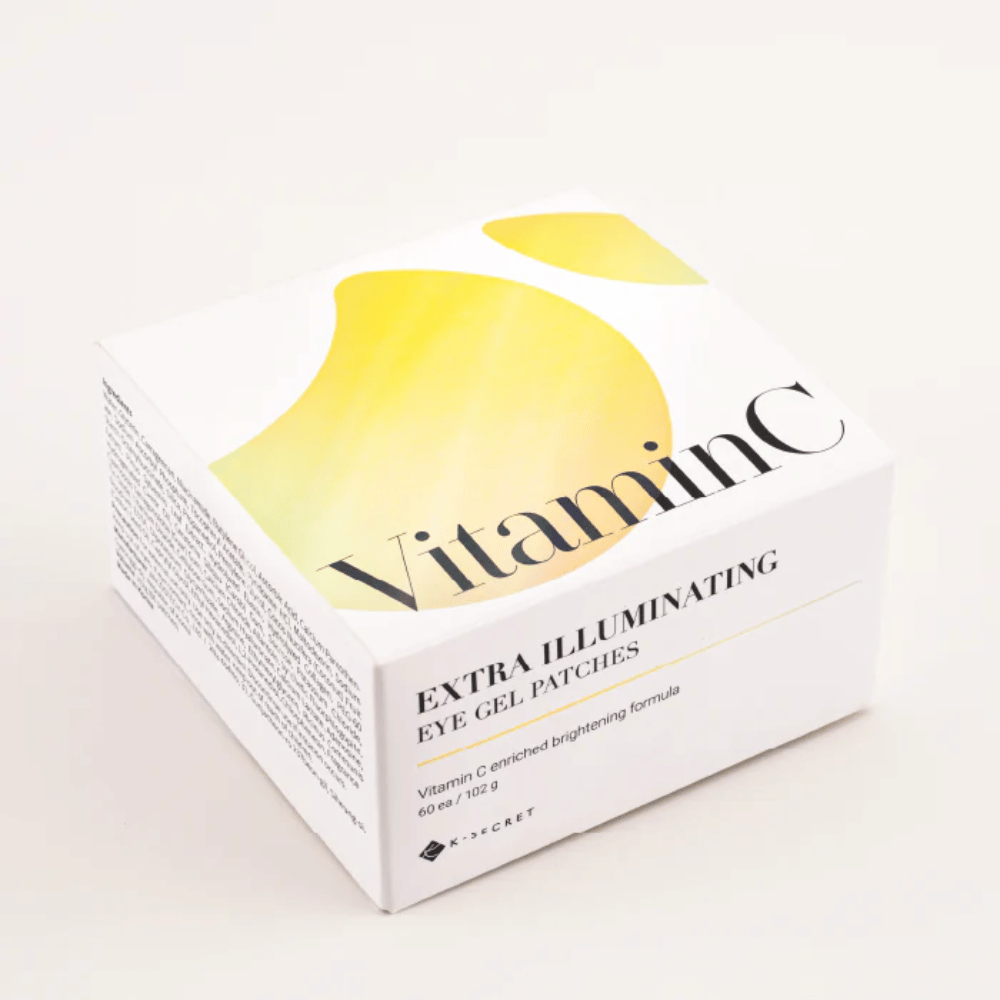 Balenie K-Secret Extra Illuminating Eye Gel Patches s vitamínom C v bielom a žltom dizajne.