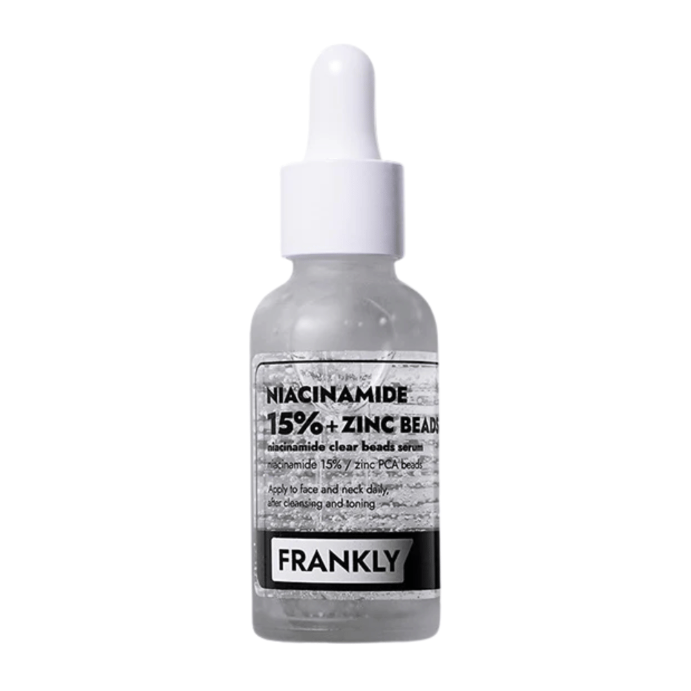 Obrázok produktu FRANKLY Niacinamide 15% + Zinc Beads Serum v sklenenej fľaši s pipetou. Sérum, ktoré vyrovnáva, upokojuje a zlepšuje jas pleti.