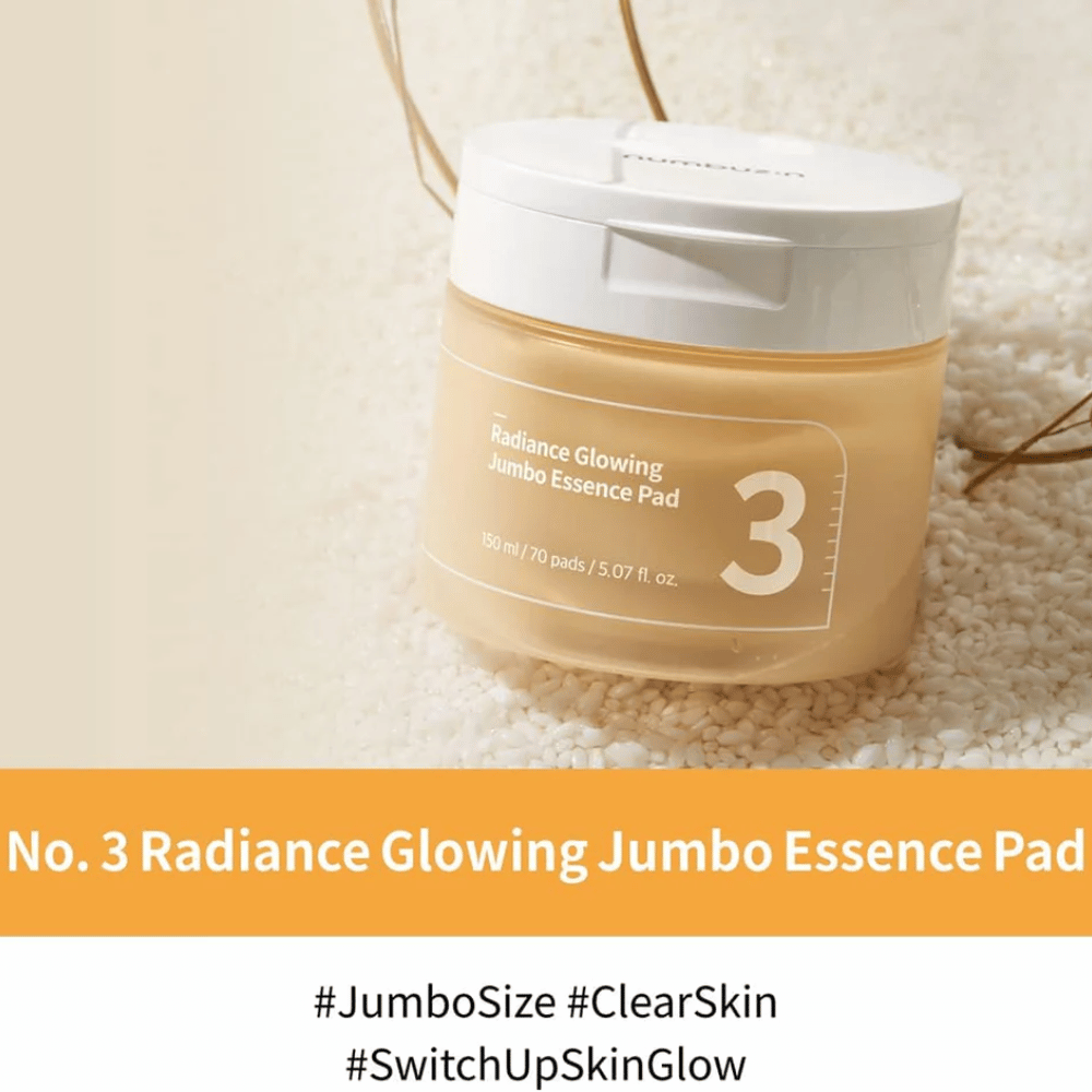Nádoba s numbuzin No. 3 Radiance Glowing Jumbo Essence Pad umiestnená na ryži, text na obrázku zdôrazňuje jumbo veľkosť a žiarivosť pokožky.