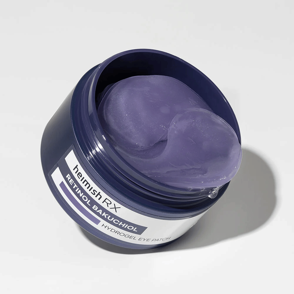 Heimish RX Retinol Bakuchiol Hydrogel Eye Patch v tmavomodrej nádobe s fialovými hydrogelovými očnými náplasťami. Produkt navrhnutý na hydratáciu a zníženie jemných liniek okolo očí.