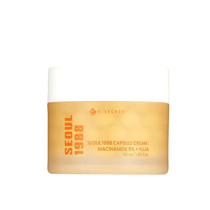 Nádoba s K-Secret Seoul 1988 Capsule Cream Niacinamide 5% + Yuja, 50 ml, v zlatom dizajnovom balení.