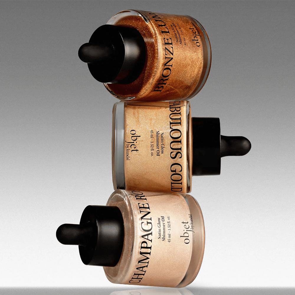 Objet by KUNDAL Satin Glow Shimmer Oil v odtieni Bronze Lumière, Fabulous Gold a Champagne Rose – trblietavé telové oleje s rozjasňujúcim finišom.