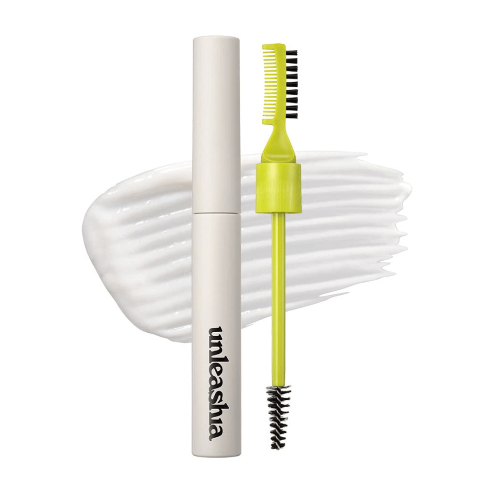 Pomáda na obočie "unleashia" s aplikátorom, zeleným hrebeňom a čiernou kefkou na bielom, vlnitom pozadí.
