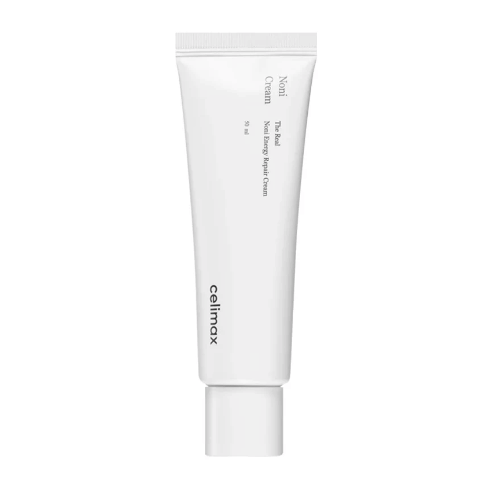 Celimax Noni Energy Repair Cream v bielej tube s čiernym textom. Produkt je označený ako "The Real Noni Energy Repair Cream" a má objem 50 ml.