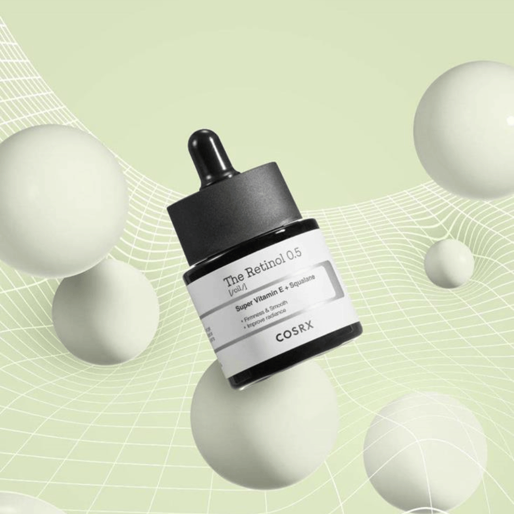 Fľaša COSRX Retinol 0.5 Olej 20ml, ktorá podporuje anti-aging výhody na bielom pozadí.